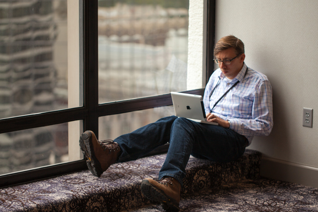Attendee does work on an iPad .